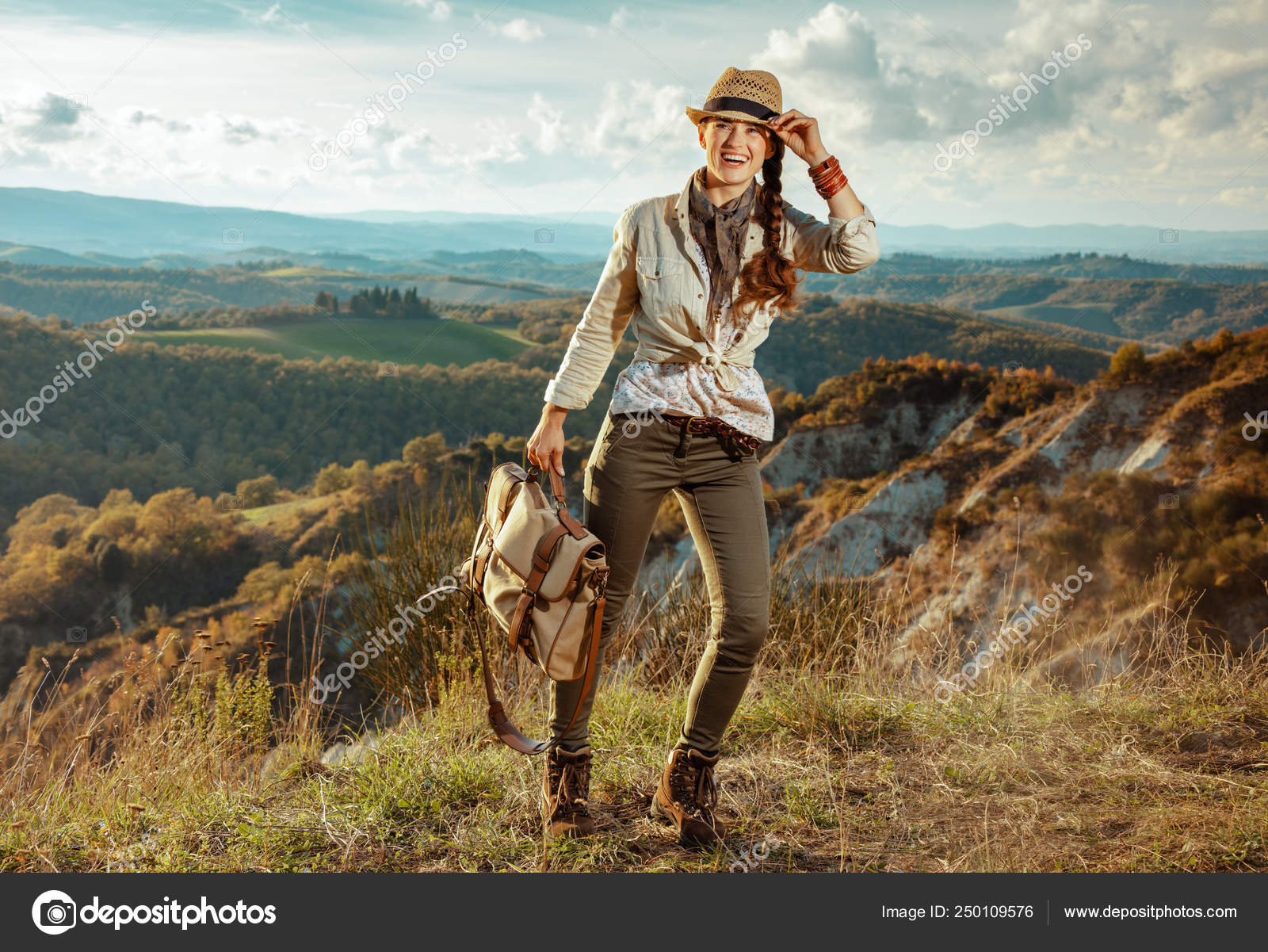 Woman hiker on summer hiking in Tuscany enjoying promenade Stock