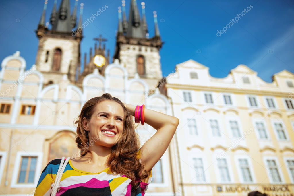 smiling young solo traveller woman exploring attractions