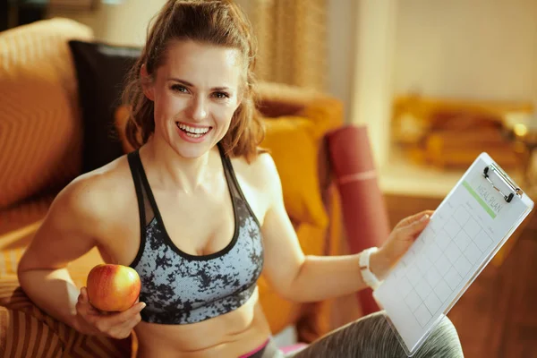 Portrait Happy Young Sports Woman Sport Clothes Holding Apple Clipboard — Stock Photo, Image