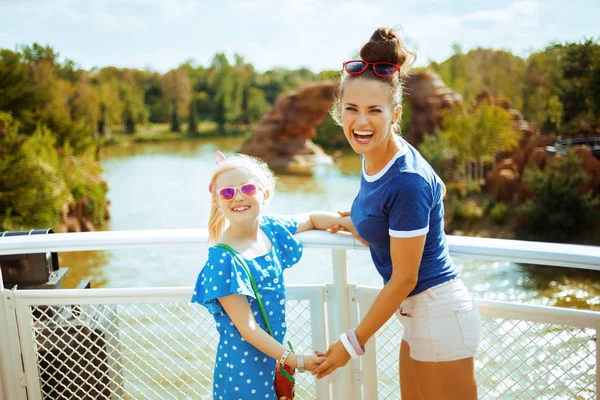 Mother and daughter tourists on river boat having river cruise — Stock Photo, Image