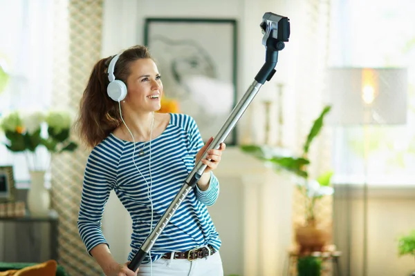Happy Years Old Woman Striped Shirt White Pants Vacuum Cleaner — Stock Photo, Image