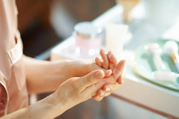 Closeup Woman Applying Hand Cream Table Toiletries Living Room Sunny — Stock Photo, Image