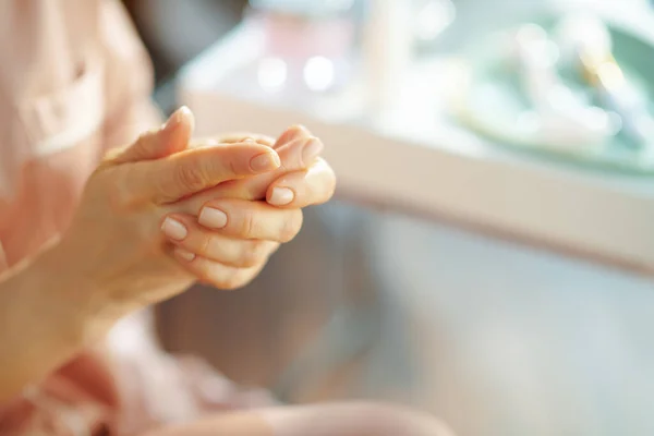 Closeup Woman Pajamas Applying Hand Cream Table Toiletries Home Sunny — Stock Photo, Image