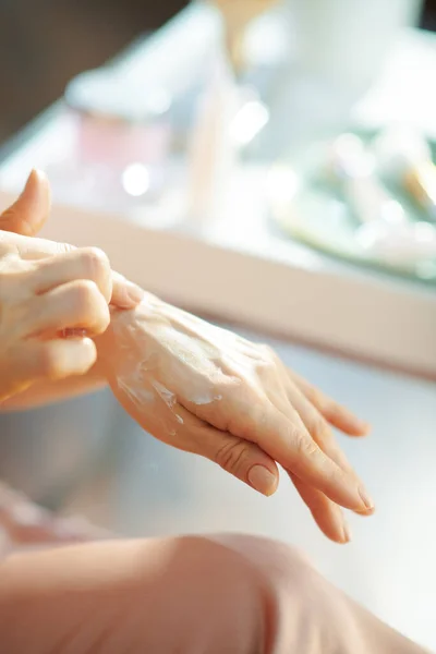 Closeup Woman Pajamas Applying Hand Cream Table Toiletries House Sunny — Stock Photo, Image