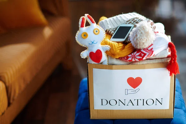 Closeup Donation Box Old Clothes Toy Smartphone — Stock Photo, Image