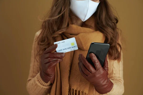 Closeup Middle Aged Woman Sweater Smartphone White Medical Mask Credit — Stock Photo, Image