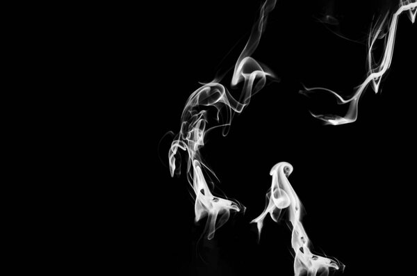White smoke on black background with copy space. Abstract concept