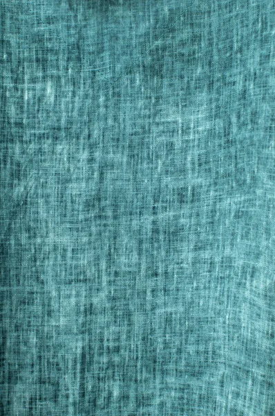 Texture of turquoise natural linen flax fabric closeup as textile background