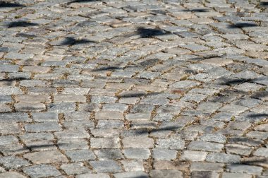 Arka plan olarak yüzey ayrıntı closeup sokak gri taş döşeli