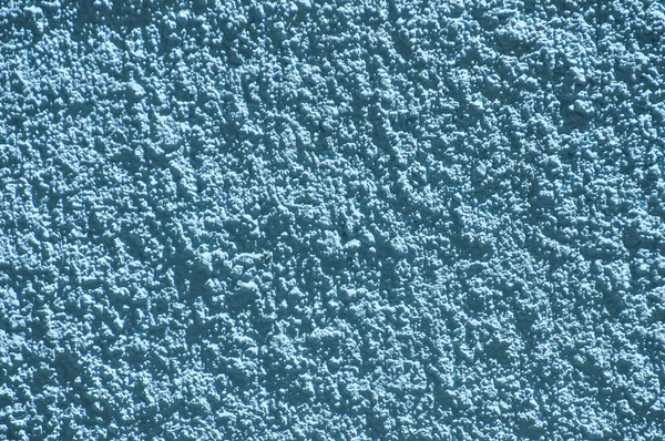 Blue color plaster house wall surface texture closeup as background