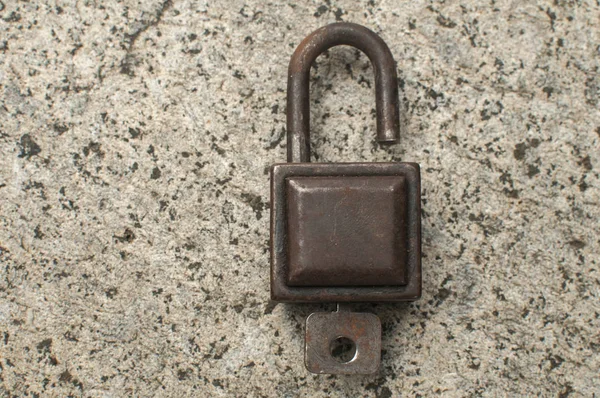 Old Weathered Grunge Retro Open Padlock Closeup Solid Stone Surface — Stock Photo, Image