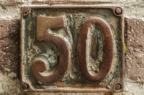 Old Retro Weathered Cast Iron Plate Number Closeup — Stock Photo, Image