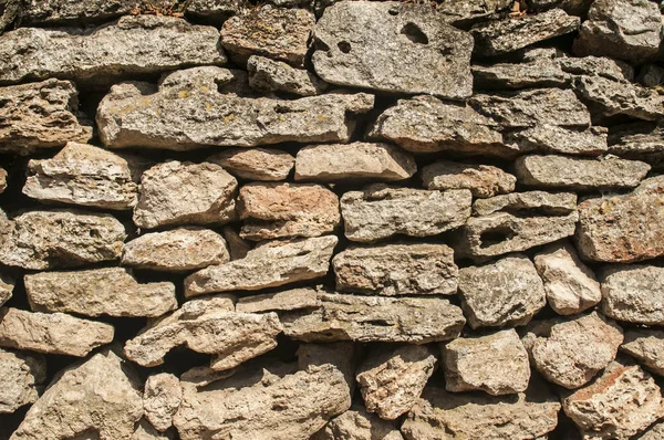 石の背景として古い農村乾燥石積み石壁クローズアップ — ストック写真