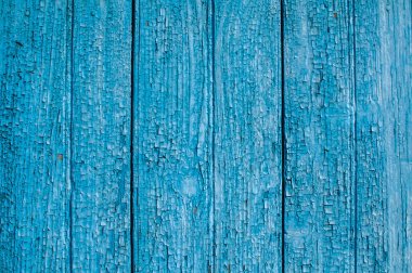 Kırık mavi boyalı eski ahşap tahtalar mavi arka plan olarak yakın plan