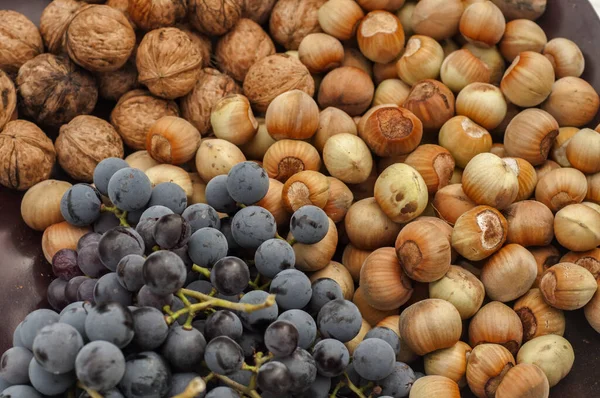 Ripe Raw Hazelnuts Walnuts Red Grape Closeup Food Background — Stock Photo, Image