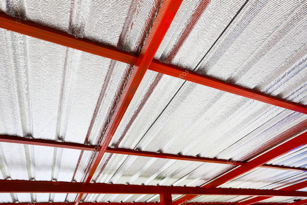 Under metal sheet attached to the roof insulation