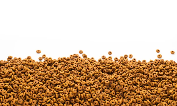 Dried dog food background. Top view Brown grain pet food banner background  with copy space of test design. Above or Top view. food panorama banner