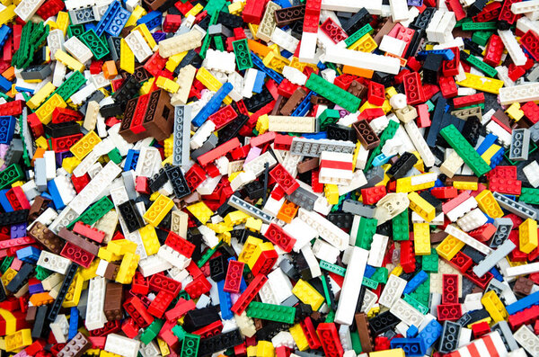 Multicolored plastic building blocks of the designer.
