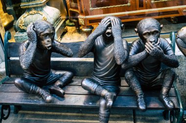 Hear no evil, speak no evil, see no evil , 3 wise monkeys statues in San Francisco. clipart