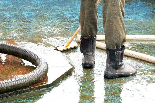 pool or fountain cleaner boots, brush removes debris from the surface, corrugated hose and old painted surface