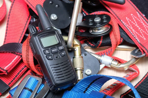 On the table are the radio and equipment for rescue climbers and industrial mountaineering — Stock Photo, Image