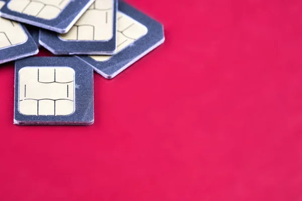 five SIM cards for smartphone on the edge of the frame