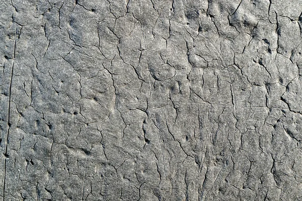 The texture of the old bitumen coating with cracks — Stock Photo, Image