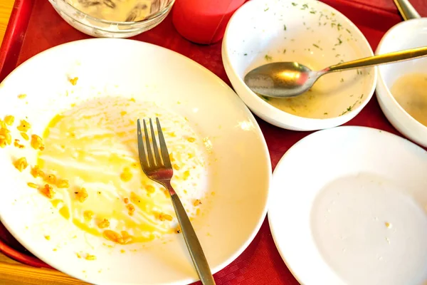 Empty plates after dinner at the restaurant traces of fat on them — Stock Photo, Image