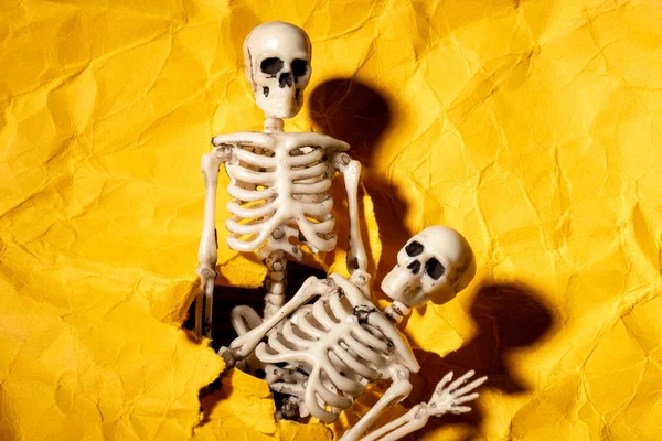 Two Skeletons Crawl Out Hole Paper Cast Shadows Sinister Atmosphere — Stock Photo, Image