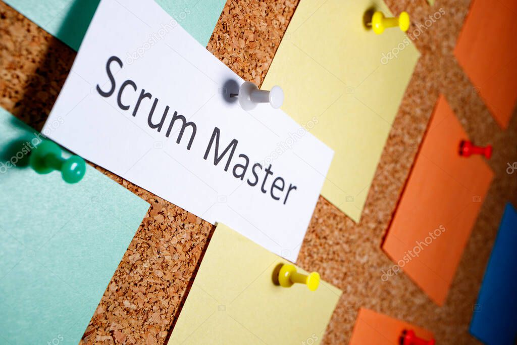 Scrum master is written on a piece of paper which on a bun is attached to a board. outgoing perspective view