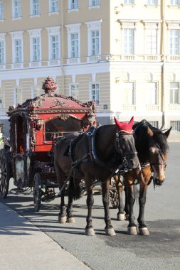 Two horses and red carriage clipart