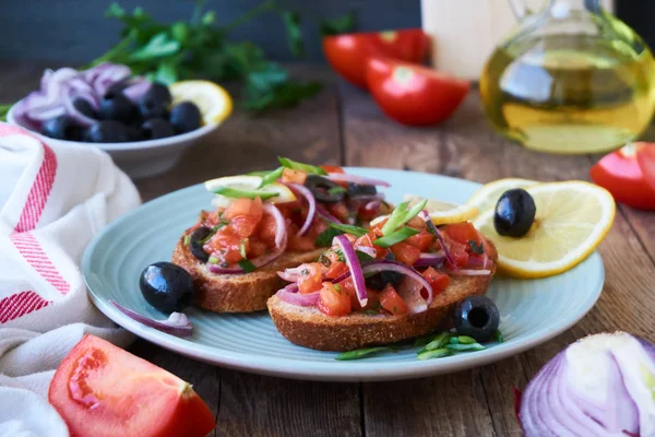Bruschetta Tomatoes Olives Red Onions Plate — Stock Photo, Image