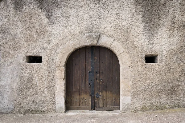 Entrance of a traditional wine cellar in Lower Austria, door and ventilation hole, initials of the first owner above the door
