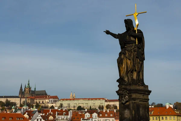 The statue of John the Baptist on Charles bridge in Prague (Czech Republic)