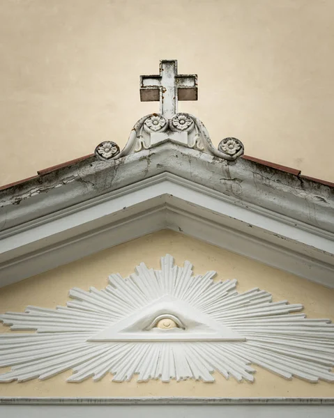 The Eye of Providence over the entrance of church St. Johannes in Laas