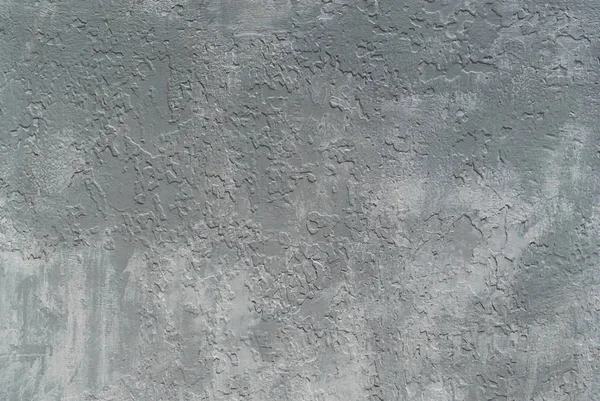 Photo of a metal texture carelessly painted in gray and white over the old paint