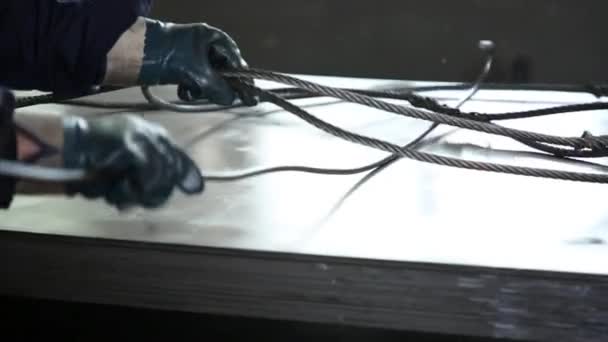 Worker Special Hook Corrects Steel Cables Lie Metal Sheets Shop — Stock Video