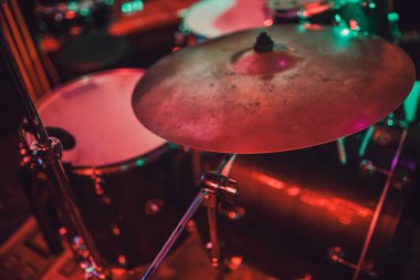 Drum kit on stage in the spotlight color. clipart