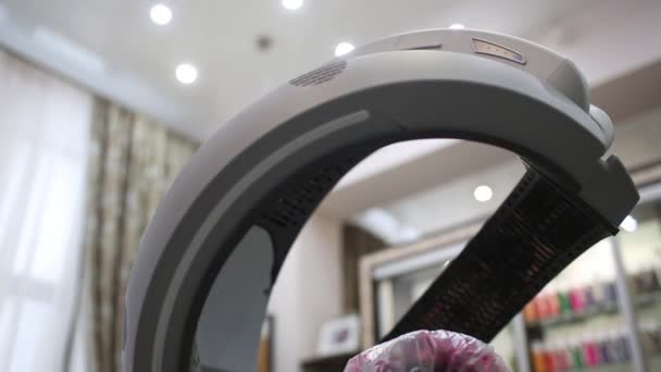 Hooded hair dryer standing on wheels. Salon equipment. infrared Klimamon. — Stock Video