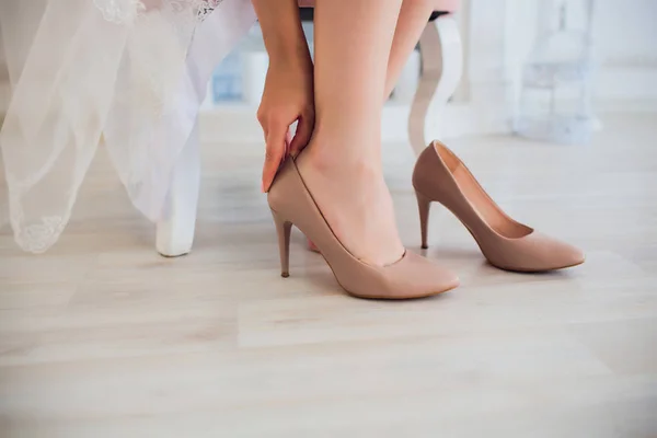 Woman putting on high heel shoes, top view. — Stock Photo, Image