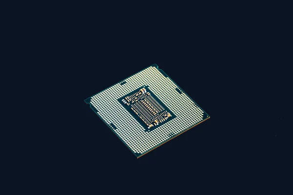 Electronic collection - CPU from the bottom side isolated on black background. — Stock Photo, Image