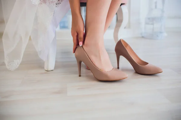 Woman putting on high heel shoes, top view. — Stock Photo, Image