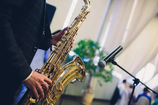 Musical instruments, Saxophone Player hands Saxophonist playing jazz music. Alto sax musical instrument closeup.