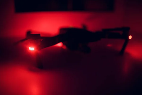 close up spare part drone pro on white. One most portable drones in market. selective focus, red illumination in the dark