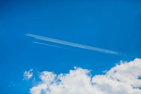 Group four aircraft performing aerobatics White cloud — Stock Photo, Image