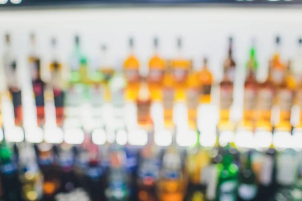 Out of focus bar, shelf of alcoholic bottles. — Stock Photo, Image