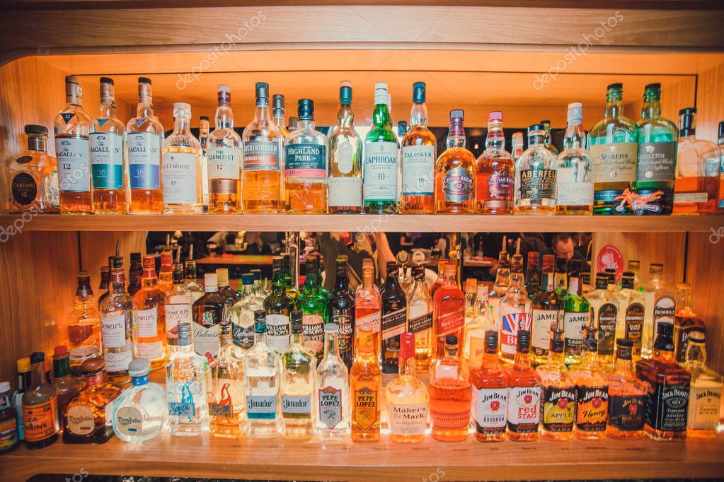 Ufa, Russia, Darling Bar, 20 November, 2018: Various alcohol bottles in a bar, back light all logos