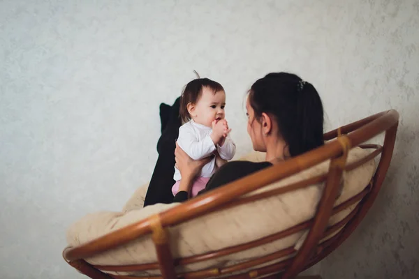 Funny baby girl with mother at home. — Stock Photo, Image