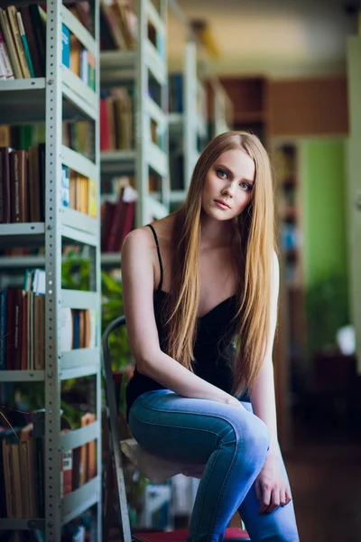 Thoughtful concept. sitting library woman girl — Stock Photo, Image