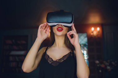 Woman using the virtual reality headset clipart